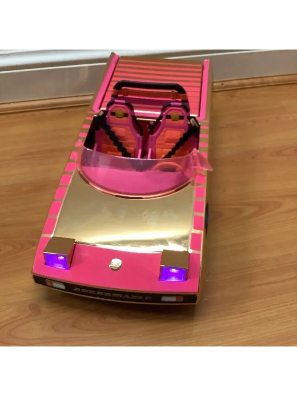 LOL Surprise! Car-pool Coupe Toy Car Playset with Black Light Headlights.